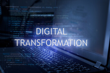 Digital transformation inscription against laptop and code background. Technology concept. Learn...