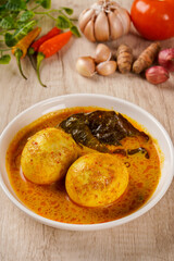 Gulai telur or eggs serve with curry sauce, Gulai Telur is traditional food of Indonesia from Padang, West Sumatera.
