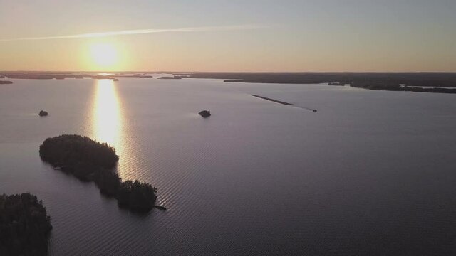 Sunset behind islands at lake Saimaa