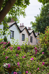 Fototapeta na wymiar Old clapboard fishermen's cottages, with beautiful gardens, Ferrol Road, Gosport, Hampshire, UK