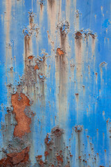 Rust and peeling blue paint.