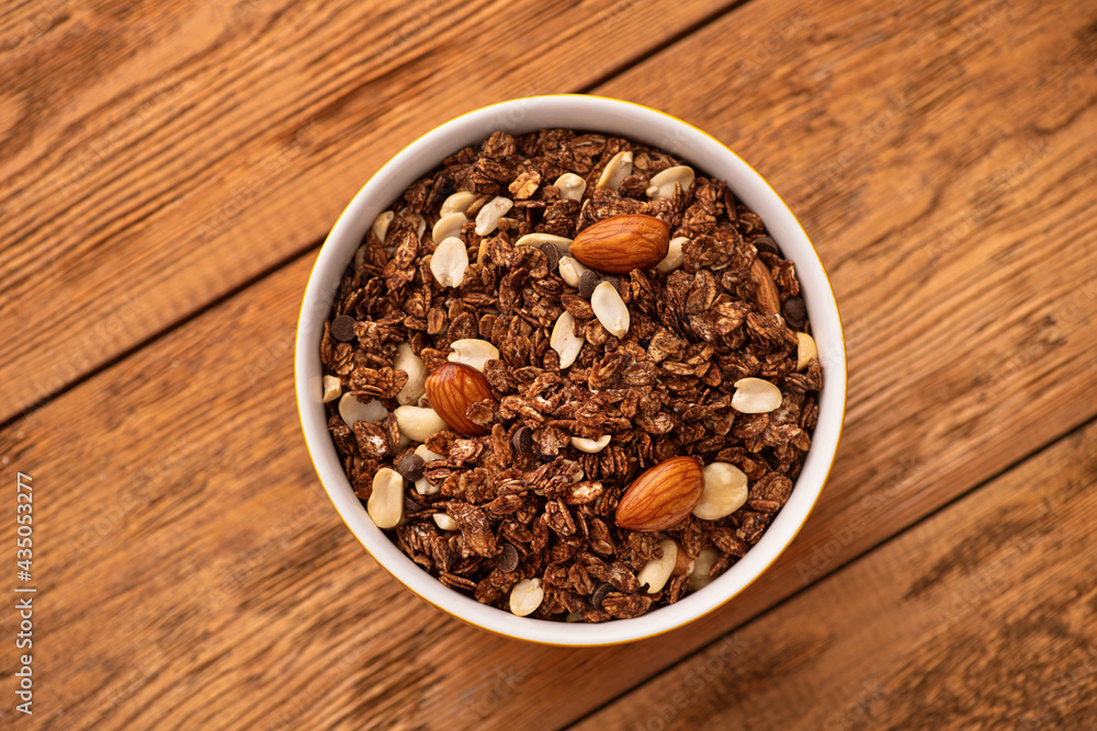 Wall mural chocolate granola with almond, nuts in a bowl