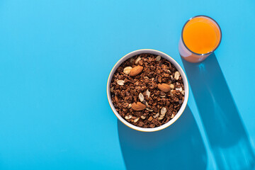Granola with almond and peanut in orange bowl - Powered by Adobe