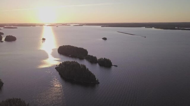 Sunset behind islands at lake Saimaa