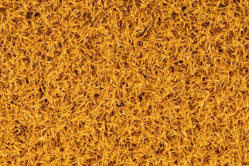 Artificial yellow grass carpet texture