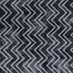 Close up of a soft carpet texture with chevron pattern