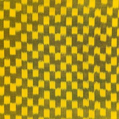 Cotton checkered fabric texture with yellow square weaves