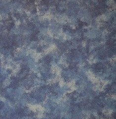 Denim blue polyester fabric texture with mottled effect