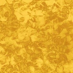 Dyed cotton fabric texture with mottled effect in yellow