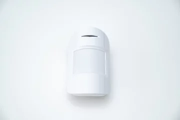 Fotobehang motion sensor on the white background. device that tracks movement of objects. © Maria