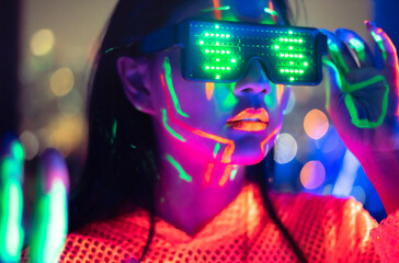 Neon  asian woman dancing. Fashion model woman in neon light, portrait of beautiful model with...