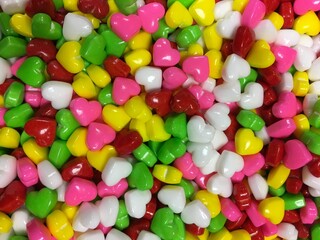 Fototapeta na wymiar Multicolored heart scaled jelly beans