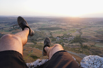 On the edge of a cliff during sunrise