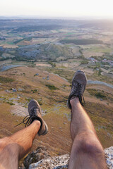 On the edge of a cliff during sunrise