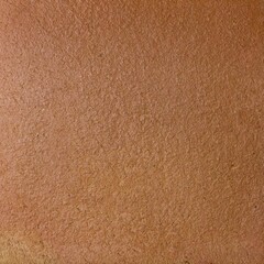 Rough terracotta wall tile with uneven ragged surface