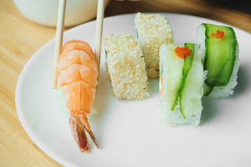 Japanese kitchen. Set of Japanese sushi and rolls. Food sticks.