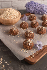 Raw energy balls. Candy vegan balls of dates, raisins, almonds, cashews, dried apricots, oatmeal.