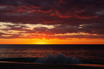 Fototapeta na wymiar Sunset over the Indian Ocean from a Madagascar beach