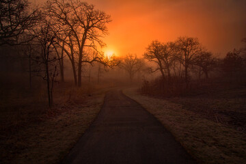 Fototapeta na wymiar Old Mill Park, Hastings, Minnesota during a foggy early morning sunrise