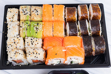 Sushi rolls in box. Set of sushi