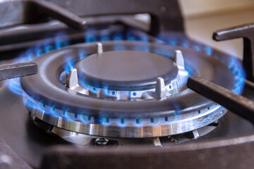 A burning gas burner in the kitchen. The use of natural gas in the household.