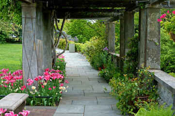 Fototapeta na wymiar Pergola on Great Lawn. Wave Hill in Hudson Hill section of Riverdale in Bronx, New York City