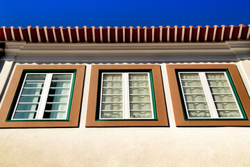 Old colorful typical facade next to the water canal in Aveiro village in Porto