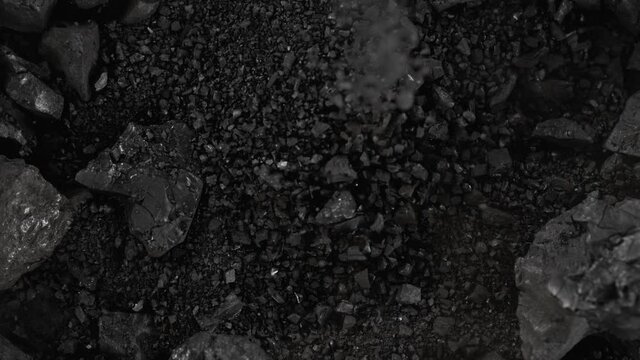 Super Slow Motion Shot of Falling Coal Crumb at 1000 fps.