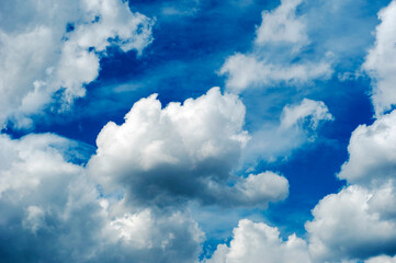 Obraz premium blue sky with dark blue, gray and white clouds with background texture