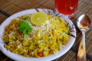 Pohe is Flattened rice. Kande pohe is a popular breakfast of Maharashtra, India