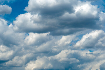 Fototapeta premium blue sky with dark blue, gray and white clouds with background texture