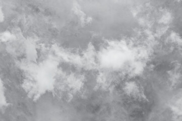 blue sky with dark black, gray and white clouds with background texture