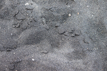 Black sand beach with volcanic stones, Maui, Hawaii, nature texture, background, close up