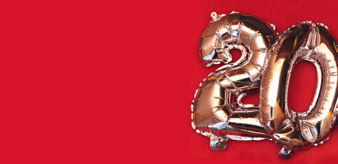 Silver Foil Balloon Number 20 On red  Background, Happy birthday balloon banner. Holiday decoration.
