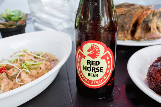 Red Horse Extra Strong beer with great food for snack or dinner. At an al fresco restaurant.