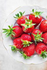 Strawberry fresh juicy fruits berries ripe harvest sweet dessert summer organic on the table healthy meal copy space food background rustic top view keto or paleo diet veggie vegan or vegetarian food