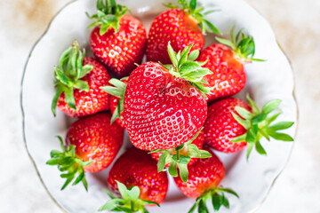 Strawberry fresh juicy fruits berries ripe harvest sweet dessert summer organic on the table healthy meal copy space food background rustic top view keto or paleo diet veggie vegan or vegetarian food