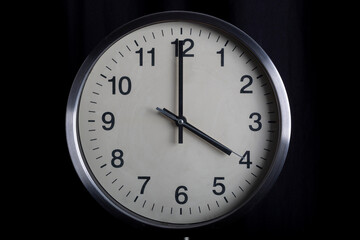 classic analog clock on black background