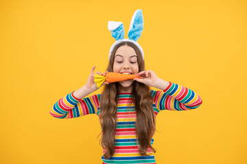 happy easter child girl in rabbit bunny ears eating carrot on holiday, easter