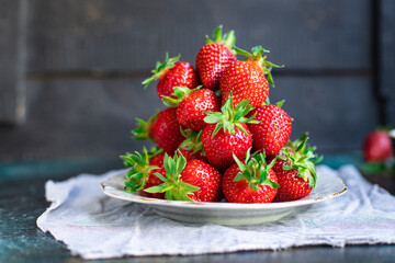 Strawberry fresh juicy fruits berries ripe harvest sweet dessert summer organic on the table healthy meal copy space food background rustic top view keto or paleo diet veggie vegan or vegetarian food