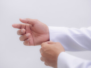 White long sleeve formula shirt There is a hand grabbing at the end of the shirt. White background. Copy space concept. Formal wear.