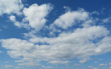 Naklejka na ściany i meble Blue sky with beautiful fluffy clouds, natural background