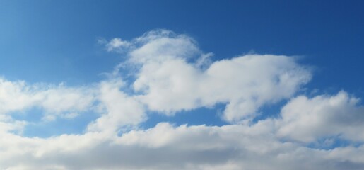 Beautiful shaped clouds in blue sky, natural background 