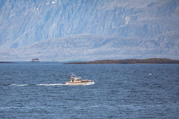 Recreational boat at speed on a spring day,Brønnøy,Helgeland,Nordland county,Norway,scandinavia,Europe