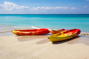 Sea kayaking, canoe, on a tourist resort in Varadero, Cuba. White sand and blue water.
