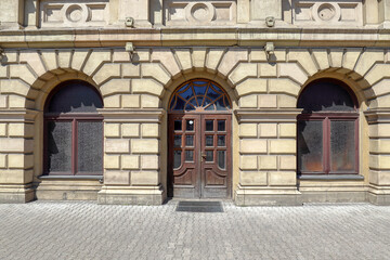 Facade of the building of the stock exchange in Kaliningrad. Arched window and doorways