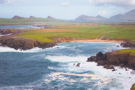 Scenic coastal seascape and landscape view from Ceann Sreatha on Waymont headland of Clogher Strand bay beach on the Dingle Peninsula, Ireland.