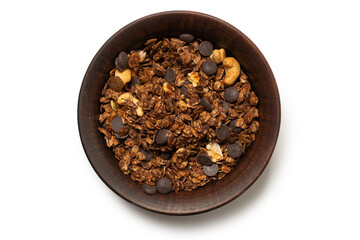 Chocolate granola cereal with nuts in a bowl background.