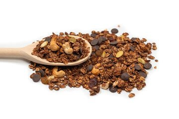 Chocolate granola cereal with nuts in a wooden spoon.