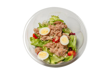 Fresh tuna salad with lettuce, cucombers, cherries and eggs in plastic container.